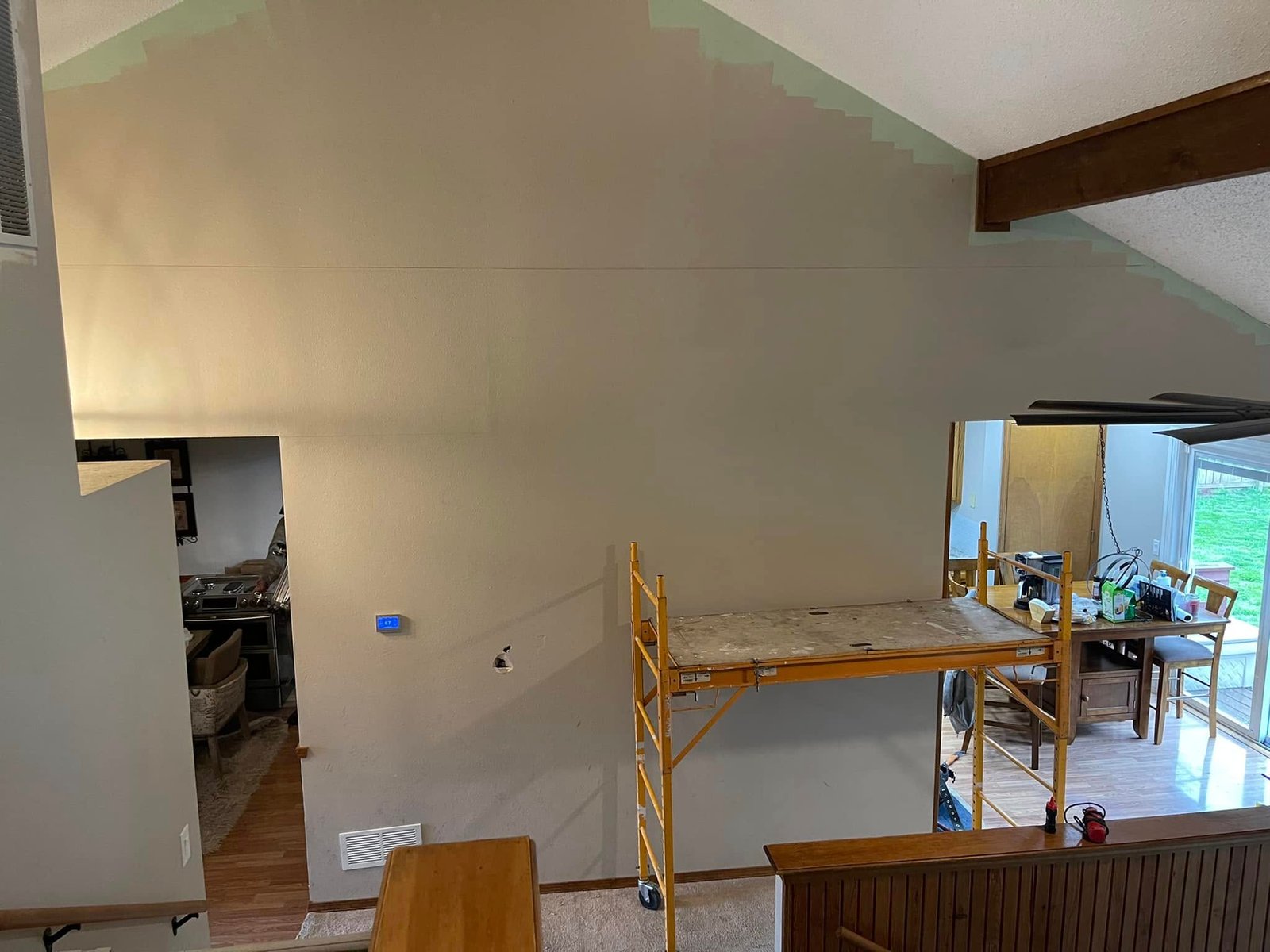 Brigmans Construction worker fitting drywall panels on a living room wall in Springfield